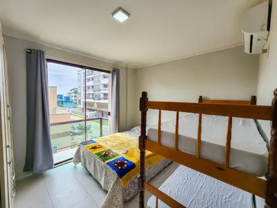 Uma cama ou camas num quarto em Apto El Shadday 202 cento e cinqüenta metros do Mar
