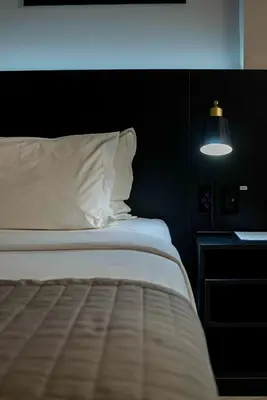 Uma cama ou camas num quarto em Santa Inn Hotel