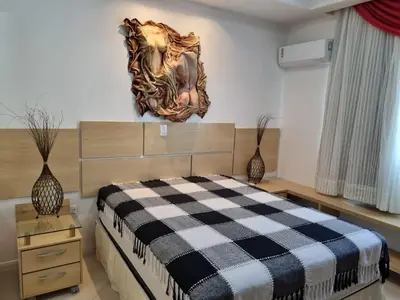 Uma cama ou camas num quarto em Aconchego na praia