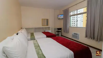 Uma cama ou camas num quarto em Hotel Gênova BC