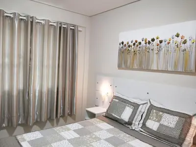 Uma cama ou camas num quarto em Don Rafael 02 dormitórios, 80m mar, Mariscal