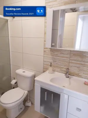 Uma casa de banho em Lindo apartamento Avenida Brasil