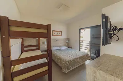 Uma cama ou camas num quarto em Parador Tropical