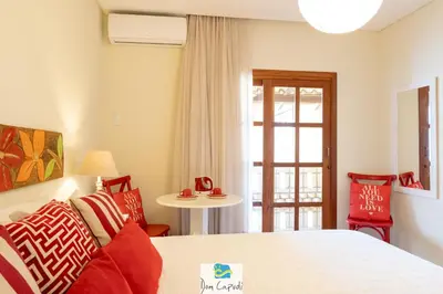 Uma cama ou camas num quarto em Pousada Dom Capudi