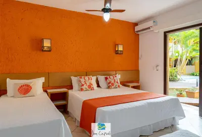 Uma cama ou camas num quarto em Pousada Dom Capudi