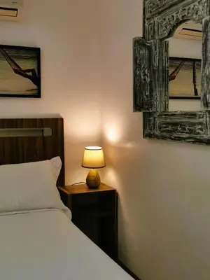 Uma cama ou camas num quarto em Pousada Estaleiro Village - Frente Mar