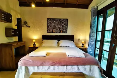 Uma cama ou camas num quarto em Pousada Estaleiro Village - Frente Mar
