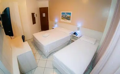 Uma cama ou camas num quarto em Pousada Villa Atlântica