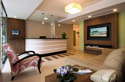 Uma televisão e/ou sistema de entretenimento em Pousada Villa Atlântica