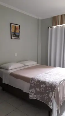 Uma cama ou camas num quarto em Carpe Diem Bombinhas