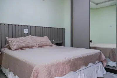 Uma cama ou camas num quarto em Pousada Refugio Costeiro