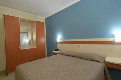 Uma cama ou camas num quarto em Refúgio Costeiro II