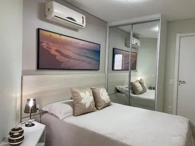Uma cama ou camas num quarto em Boulevard Bombinhas - Um condomínio Completo que vai te encantar