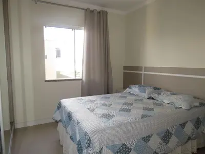 Uma cama ou camas num quarto em Res. Praia DI Capri