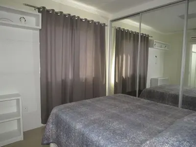 Uma cama ou camas num quarto em Res. Praia DI Capri