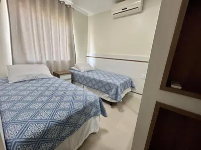 Uma cama ou camas num quarto em Res. Praia DI Capri
