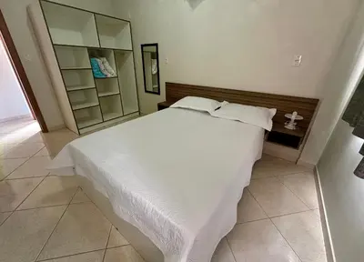 Uma cama ou camas num quarto em Res. Dona Olímpia