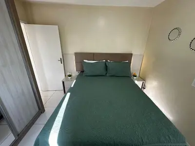 Uma cama ou camas num quarto em Ed. Solar de Bombinhas