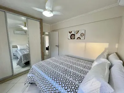 Uma cama ou camas num quarto em Ed. Solar de Bombinhas