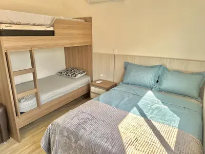 Uma cama ou camas num quarto em Apartamento Avenida F