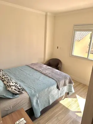 Uma cama ou camas num quarto em Apartamento Avenida F
