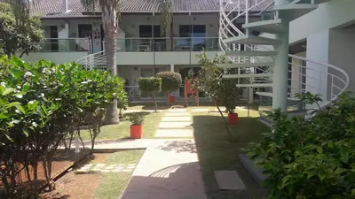 Um jardim no exterior de Pousada Morada da Praia
