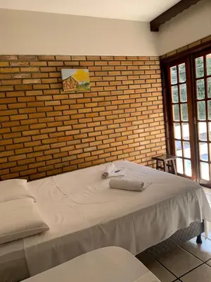 Uma cama ou camas num quarto em Hotel D'Luz