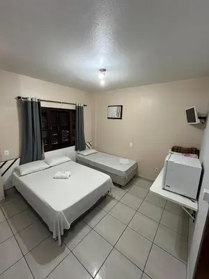 Uma cama ou camas num quarto em Hotel D'Luz