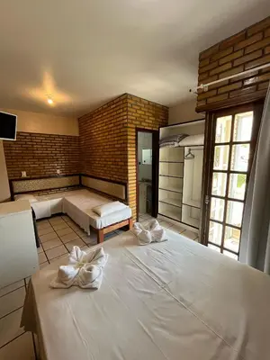 Uma cama ou camas num quarto em Hotel D'Luz