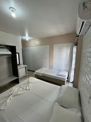 Uma cama ou camas num quarto em Hotel D'Luz