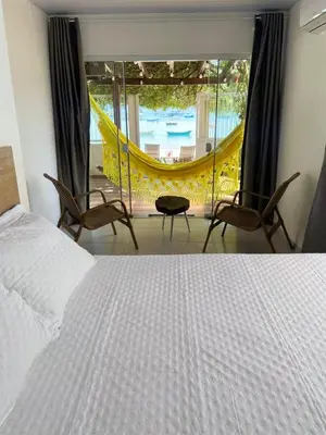 Uma cama ou camas num quarto em Casa de praia Ponta dos Ganchos de Fora