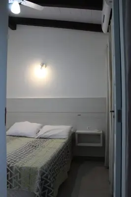 Uma cama ou camas num quarto em Residencial Annabel Apto 04