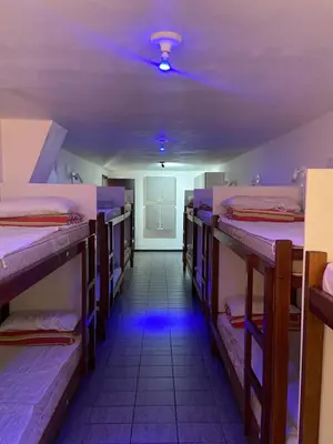 Uma cama ou camas num quarto em Quatro Ilhas Beach Hostel