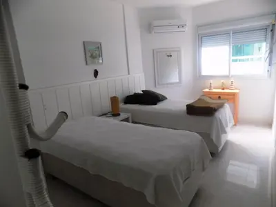 Uma cama ou camas num quarto em Temporada Praia de Palmas SC