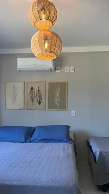 Uma cama ou camas num quarto em Residencial Rumo ao Mar - Bombinhas-SC