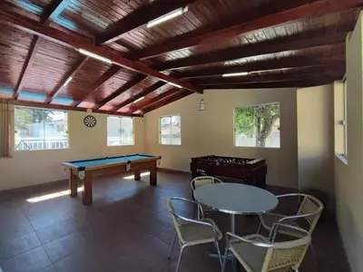 Uma mesa de bilhar em DS2 - 2 Dorm PIscina AR WIFI Churrasqueira - BRUNO KLEMTZ