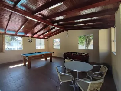Uma mesa de bilhar em DS2 - 2 Dorm PIscina AR WIFI Churrasqueira - BRUNO KLEMTZ