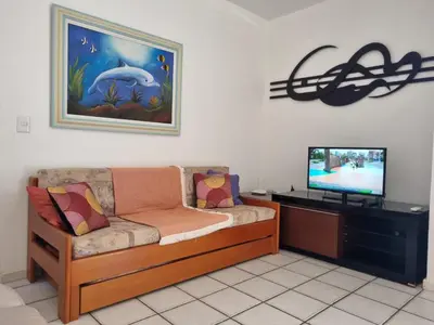 Uma televisão e/ou sistema de entretenimento em Casa de praia em Palmas-SC a 40 metros do mar