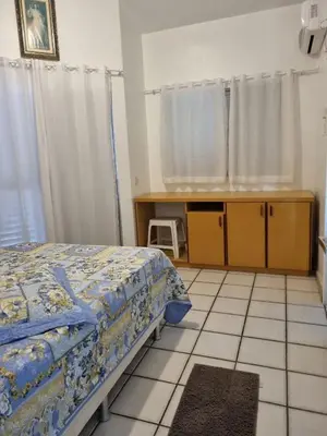 Uma cama ou camas num quarto em Casa de praia em Palmas-SC a 40 metros do mar
