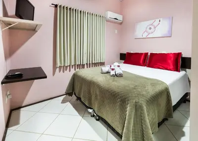 Uma cama ou camas num quarto em Pousada Vila Taquaras