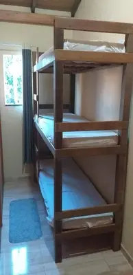 Uma cama ou camas num quarto em Casa do Jefferson