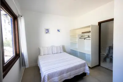 Uma cama ou camas num quarto em Bela e Aconchegante