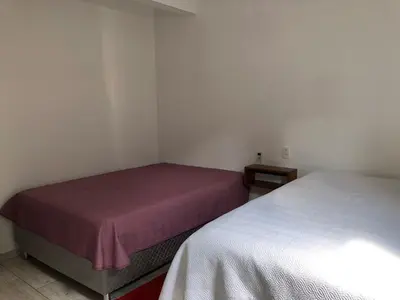 Uma cama ou camas num quarto em Casa próxima a praia de Calheiros