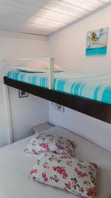 Uma cama ou camas num quarto em Casa Mico Leão Dourado