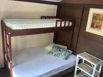 Uma cama ou camas num quarto em Casa Mico Leão Dourado