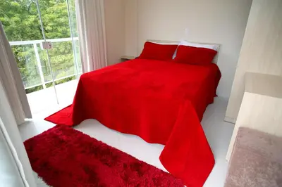 Uma cama ou camas num quarto em Pousada Magnus