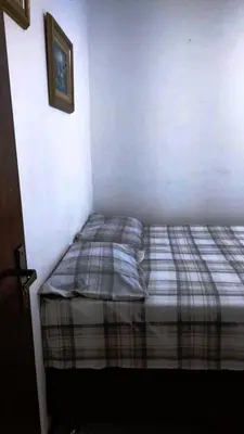 Uma cama ou camas num quarto em Praticidade em Mariscal - Bombinhas