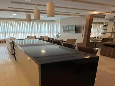 Uma televisão e/ou sistema de entretenimento em ANSNEGOCIOS DUPLEX FRENTE PRAIA MARISCAL 205 Palm