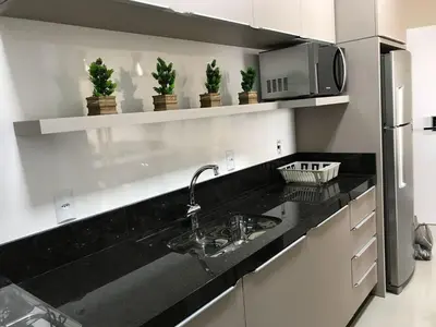 A cozinha ou kitchenette de ANSNEGOCIOS LINDO APTO PRAIA MARISCAL CASAGRANDE- Ac