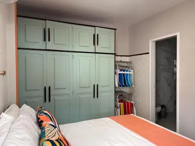 Uma cama ou camas num quarto em 3 Quartos beira Mar com Wifi e ar condicionado